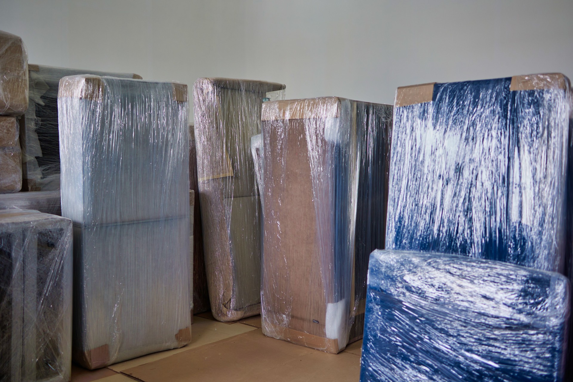 transparent film covers the upholstered parts of furniture for transportation